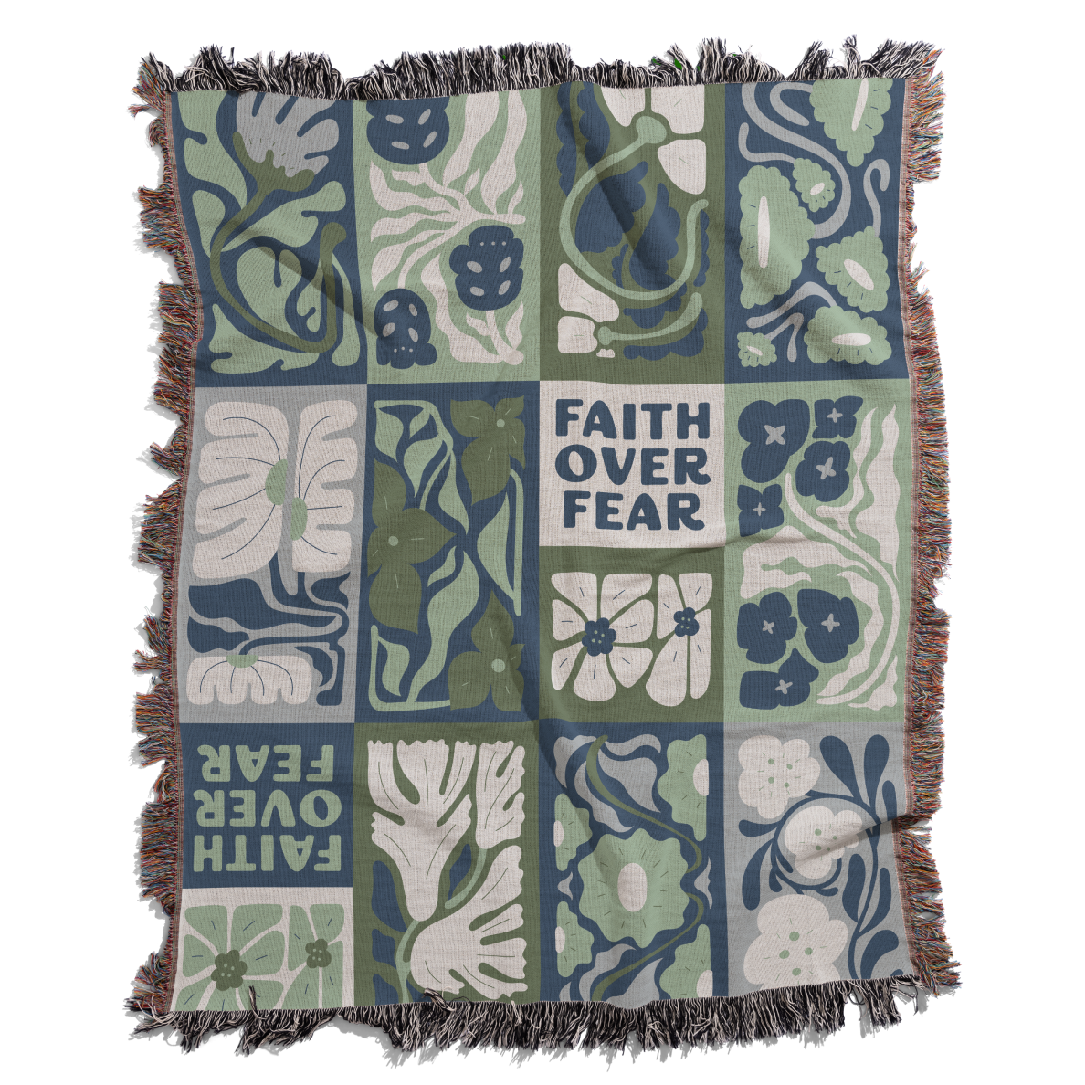 Decorative blanket with floral and animal patterns and 'Faith Over Fear' text on a white background