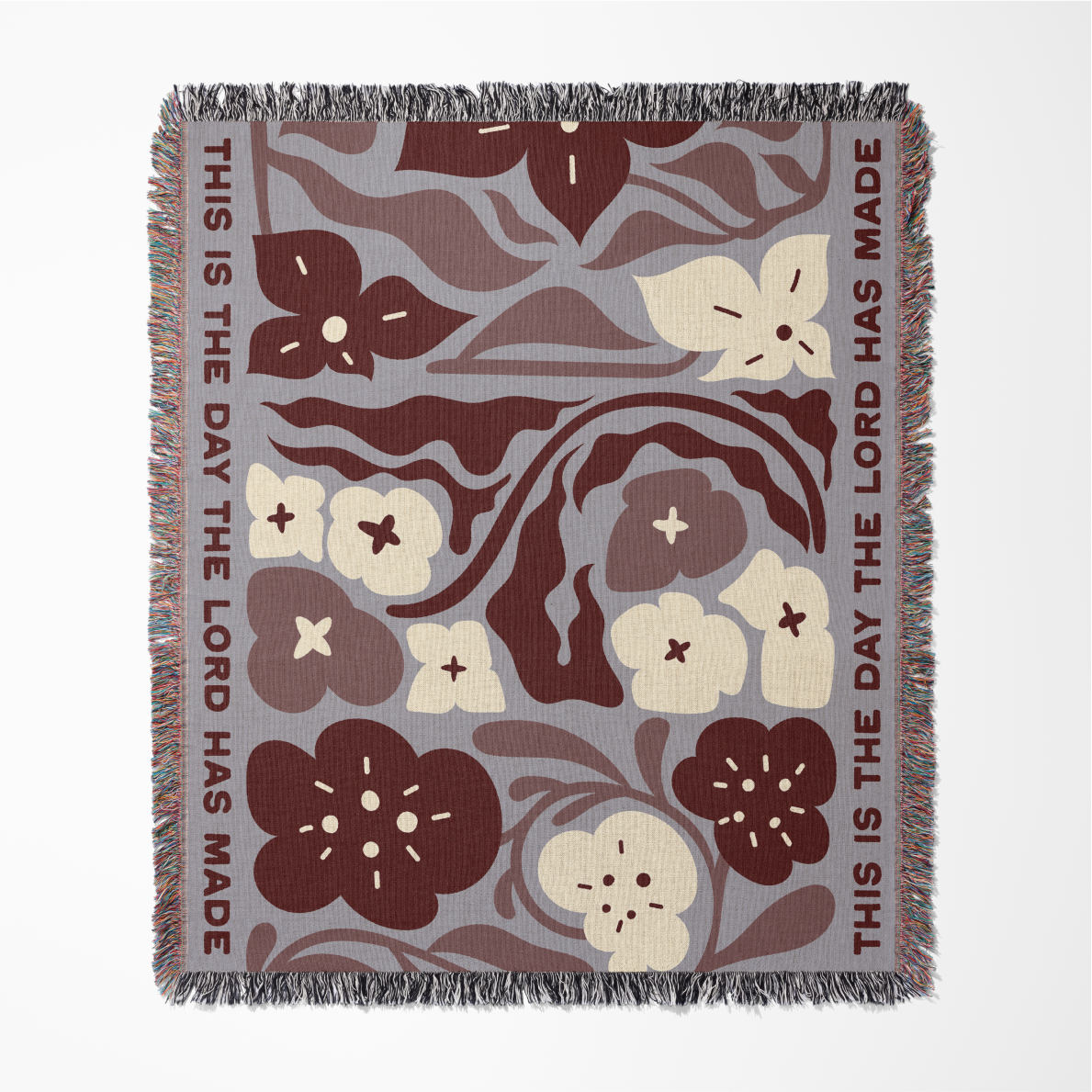 Floral patterned blanket with text on a white background