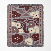 Floral patterned blanket with text on a white background