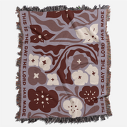 Floral patterned blanket with text on a white background