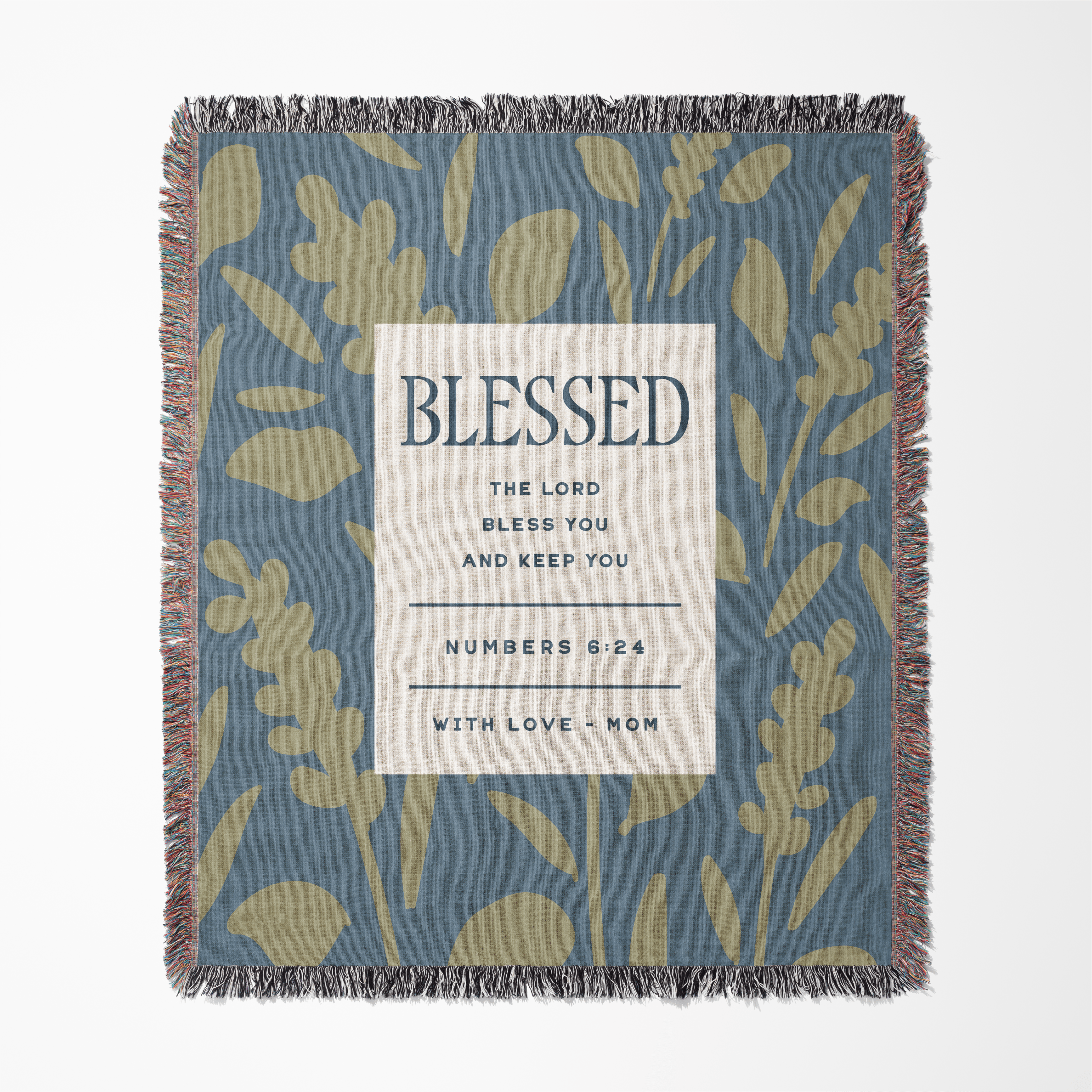 Woven blanket with floral pattern and 'Blessed' text on a blue background