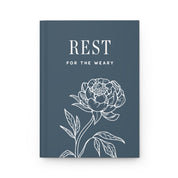 Book cover with floral design and 'REST FOR THE WEARY' text on a blue background
