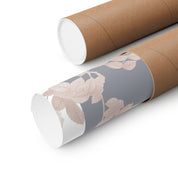 Roll of floral-patterned paper with a cardboard tube on a white background
