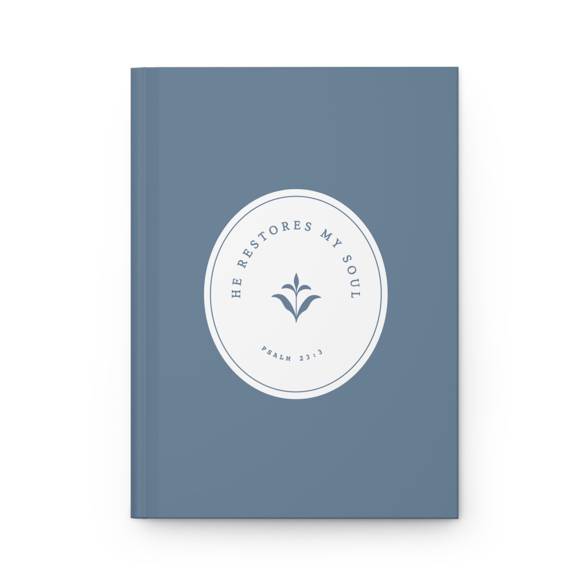 Blue notebook with a white circular design and text on a white background