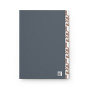 Gray notebook with a decorative corner design on a white background