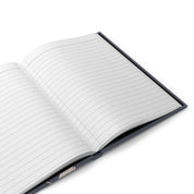 Open notebook with lined pages on a white background