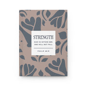 Notebook with floral pattern and motivational quote on beige background