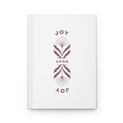White card with decorative design and 'JOY UPON JOY' text on a white background