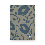 Notebook with blue floral pattern on a gray background