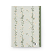 Notebook with floral design on a light gray background