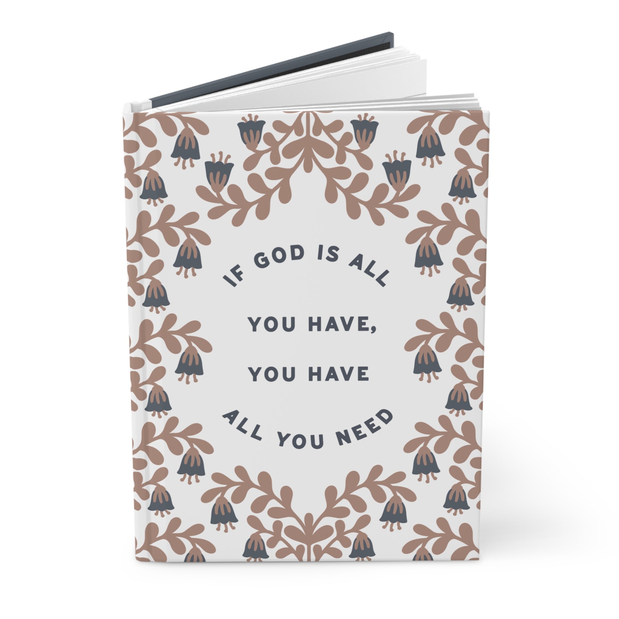 Notebook with floral design and motivational quote on a white background
