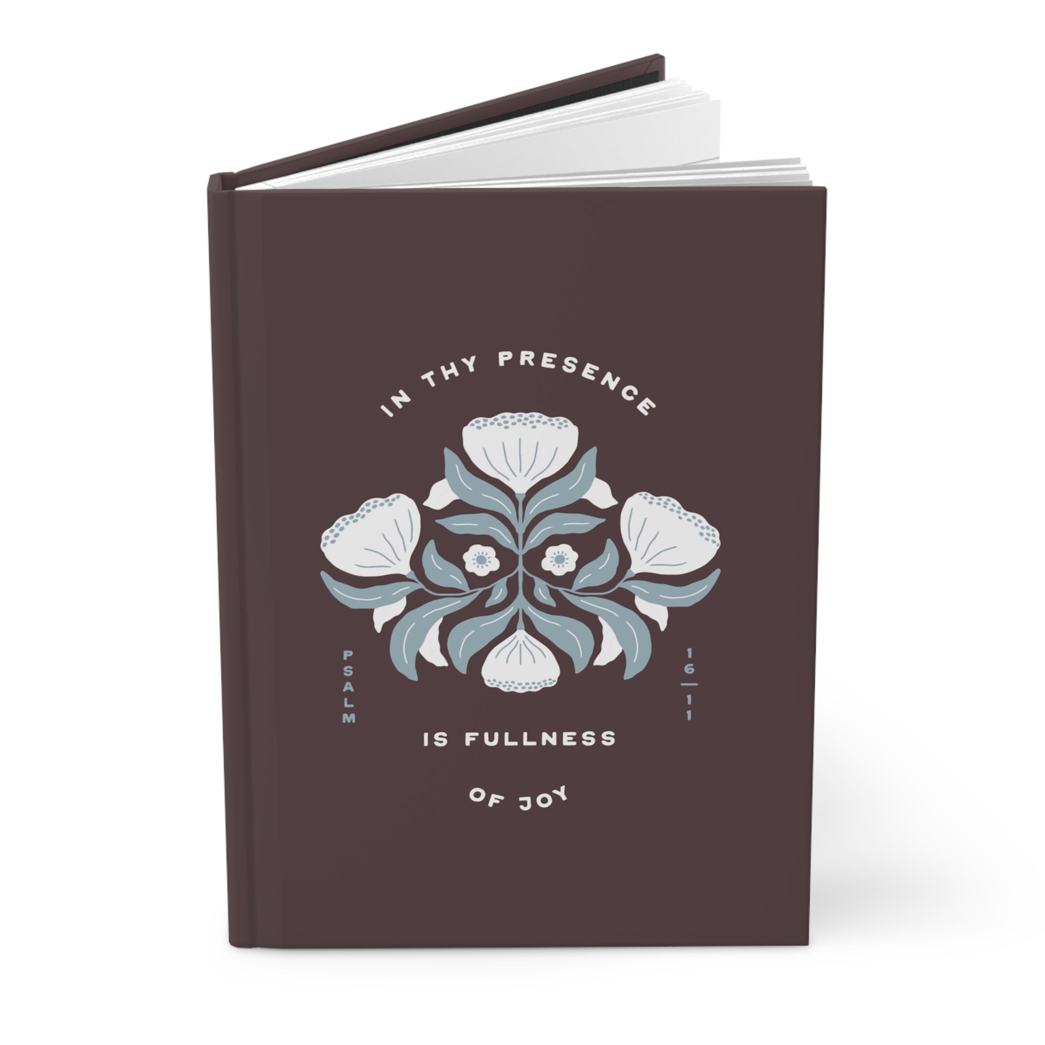 Brown notebook with floral design and text on a white background