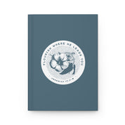 Blue notebook with floral design and text on a white background