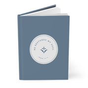Blue notebook with a circular design and text on a white background