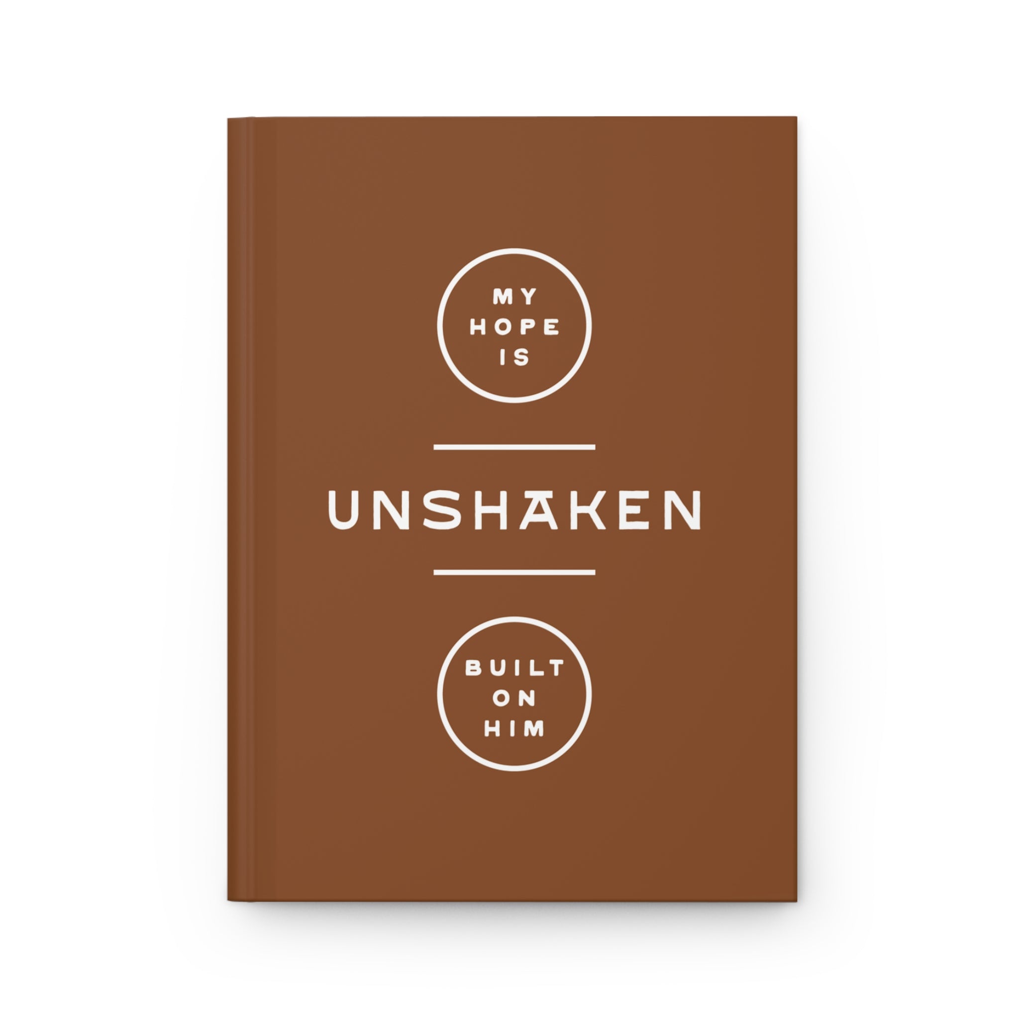 Brown notebook with white text on a white background