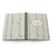 Open book with floral pattern on a white background