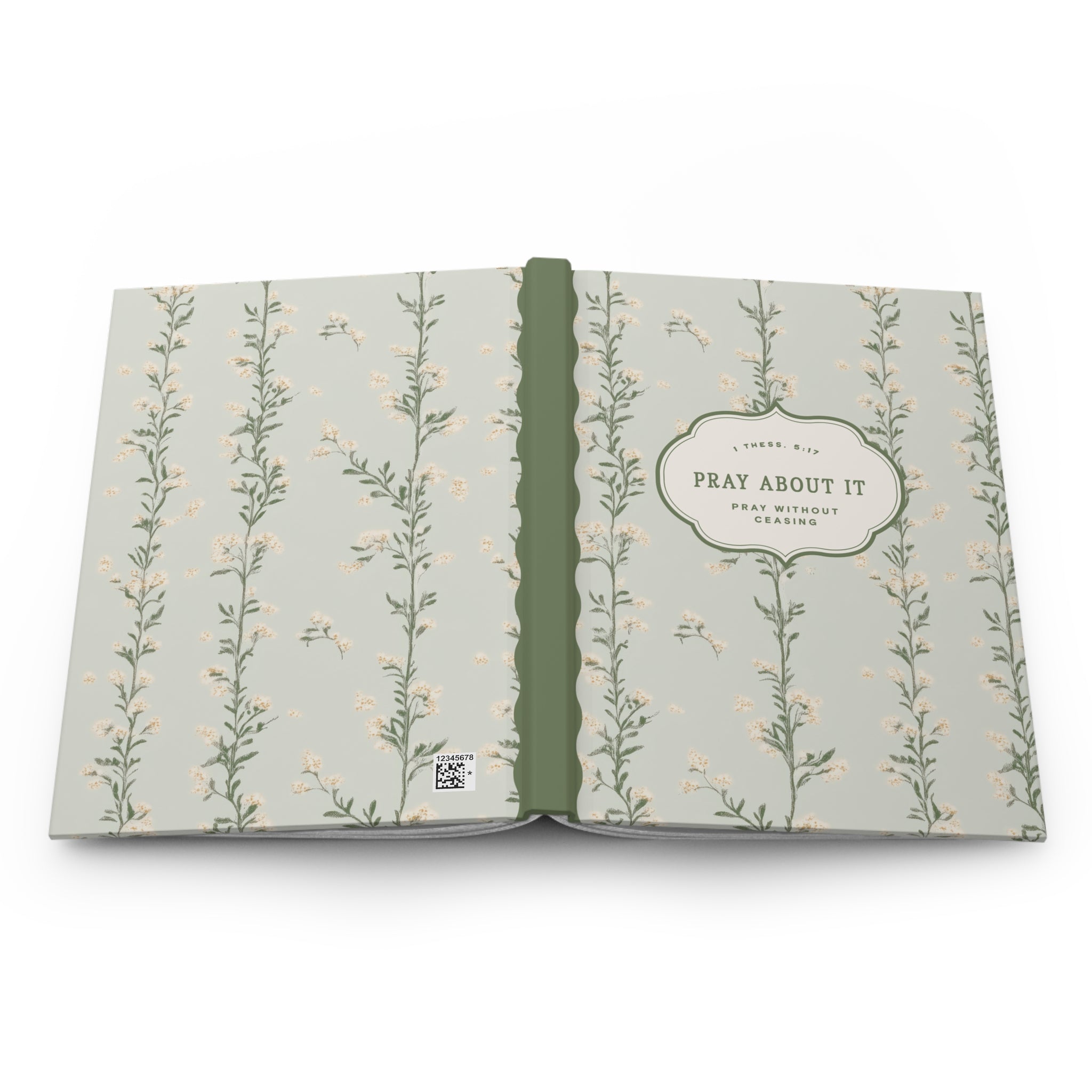 Open book with floral pattern on a white background