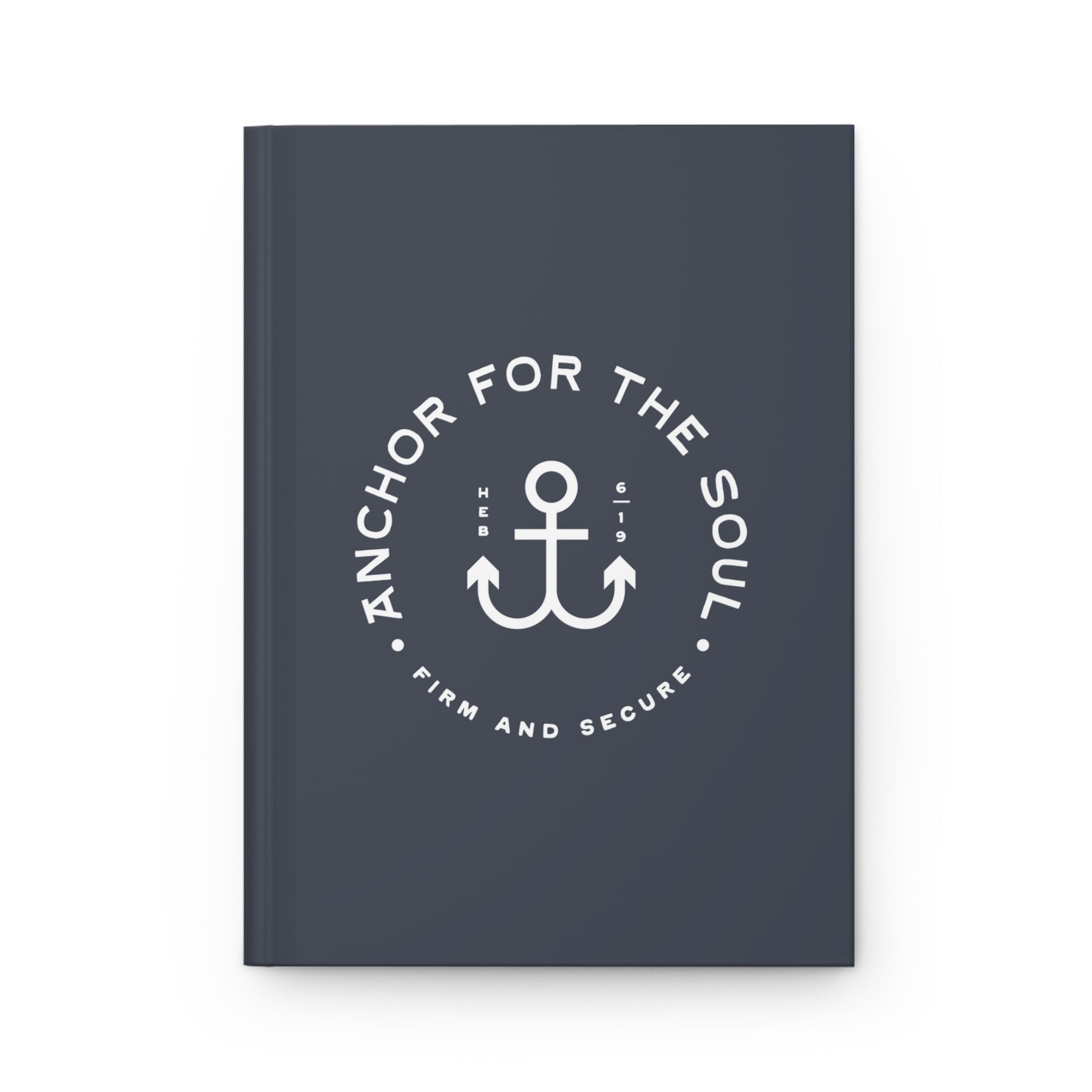 Dark blue notebook with white anchor design and text on a white background