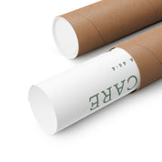 Two cardboard tubes with white paper wraps on a white background