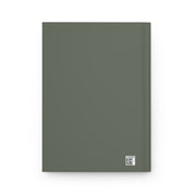 Notebook with dinosaur and star pattern on a green background