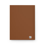 Brown notebook with a QR code on a white background