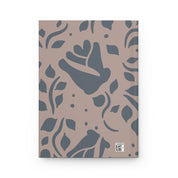 Notebook with blue floral pattern on beige background