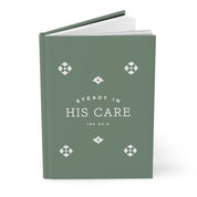 Green book with 'Steady in His Care' text and decorative elements on a white background