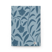 Notebook with blue floral pattern on a white background