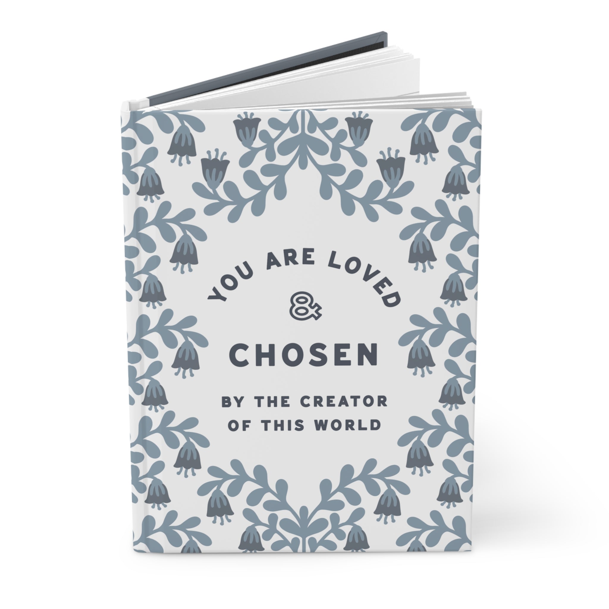 Book with motivational quote 'You are loved & chosen by the creator of this world' on a white background