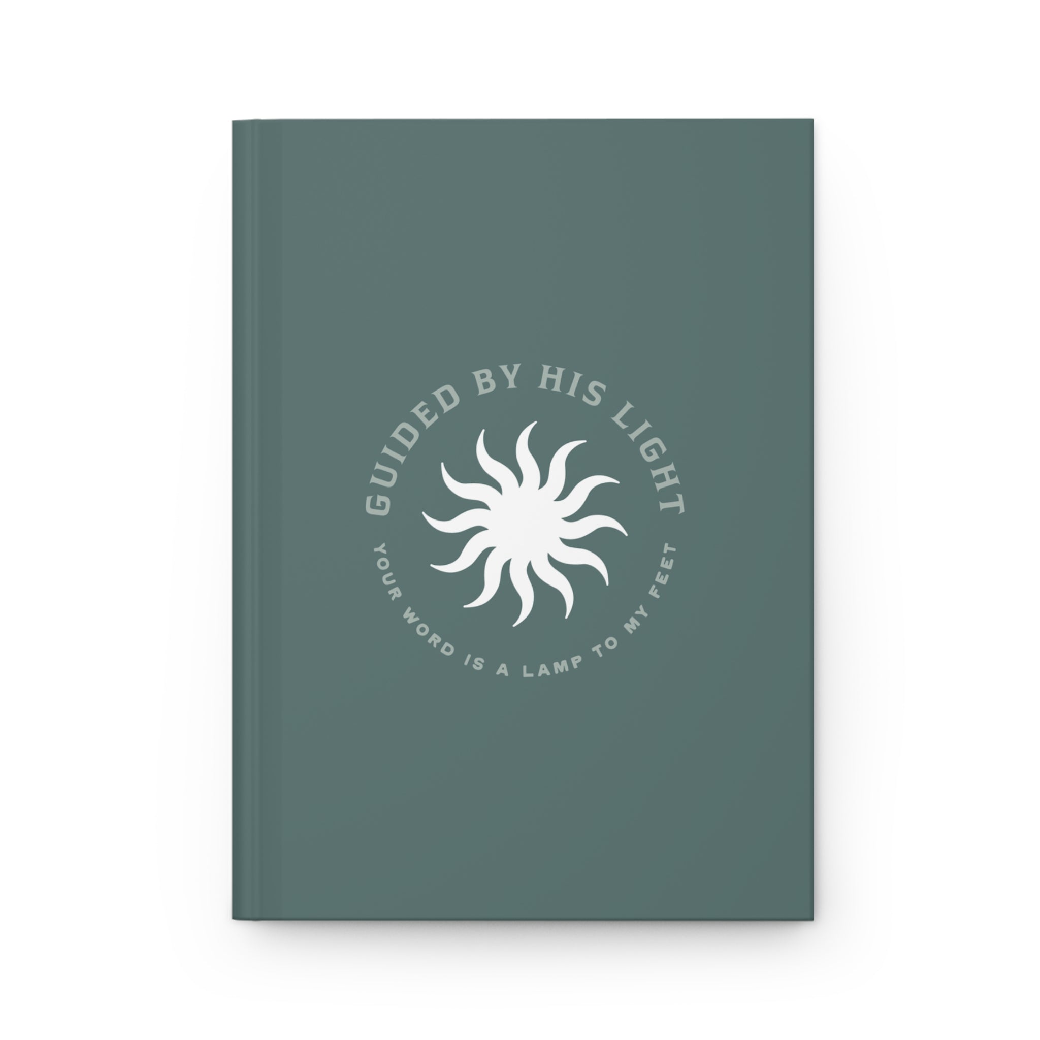 Green notebook with white text and sun design on a white background