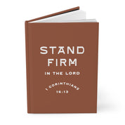Brown book with 'Stand Firm in the Lord' text on a white background