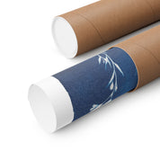 Two cardboard tubes with one featuring a blue floral design on a white background