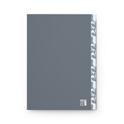 Gray notebook with a white and blue patterned edge on a white background