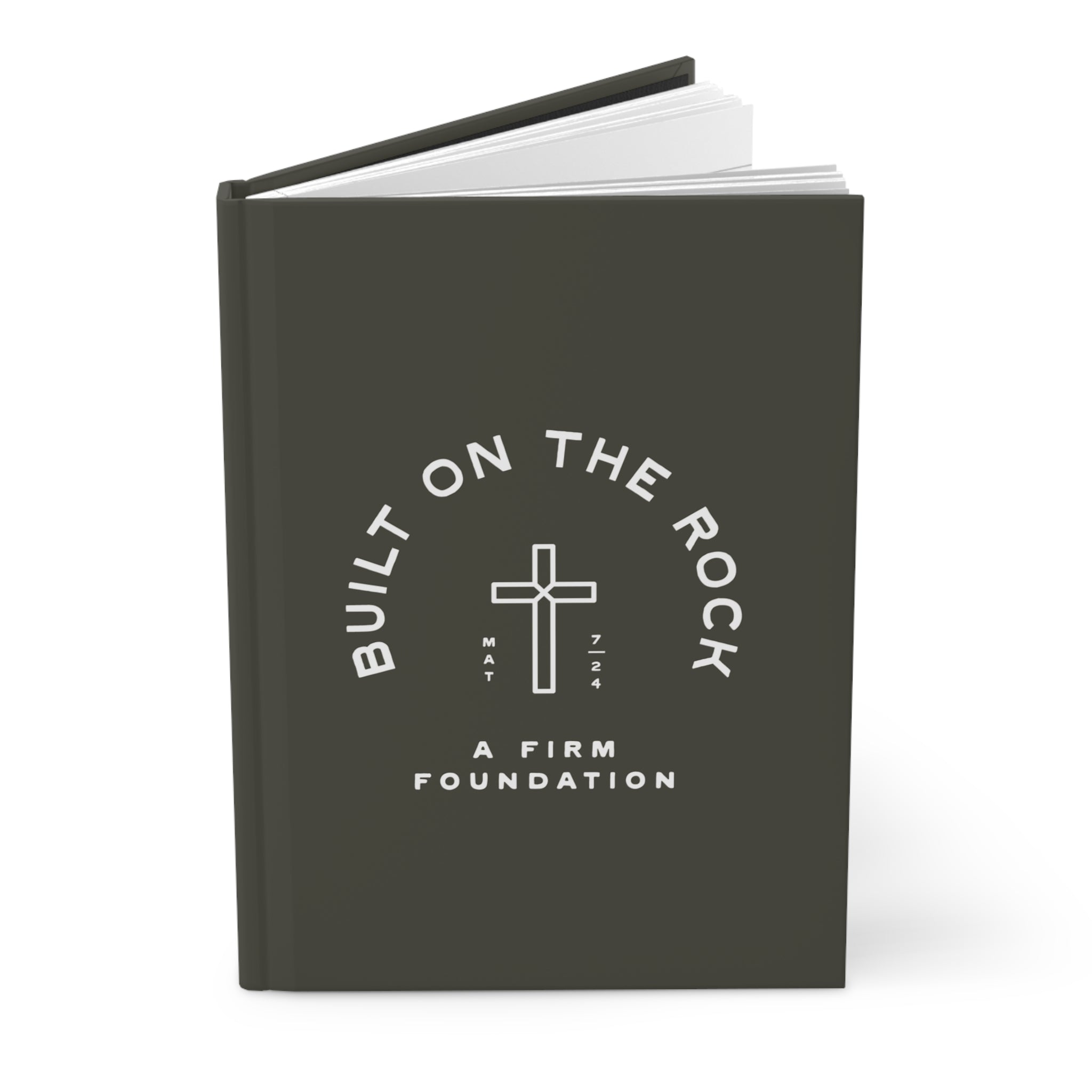 Black notebook with 'Built on the Rock, A Firm Foundation' text and cross symbol on a white background