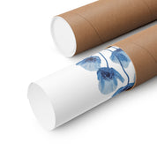 Roll of white paper with blue floral design on a cardboard tube against a white background
