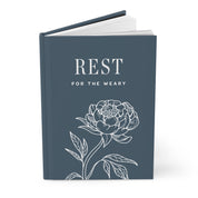 Book titled 'Rest for the Weary' with a floral design on a white background