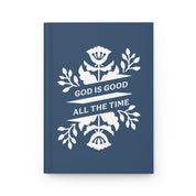 Navy blue notebook with white floral design and 'God is Good All the Time' text