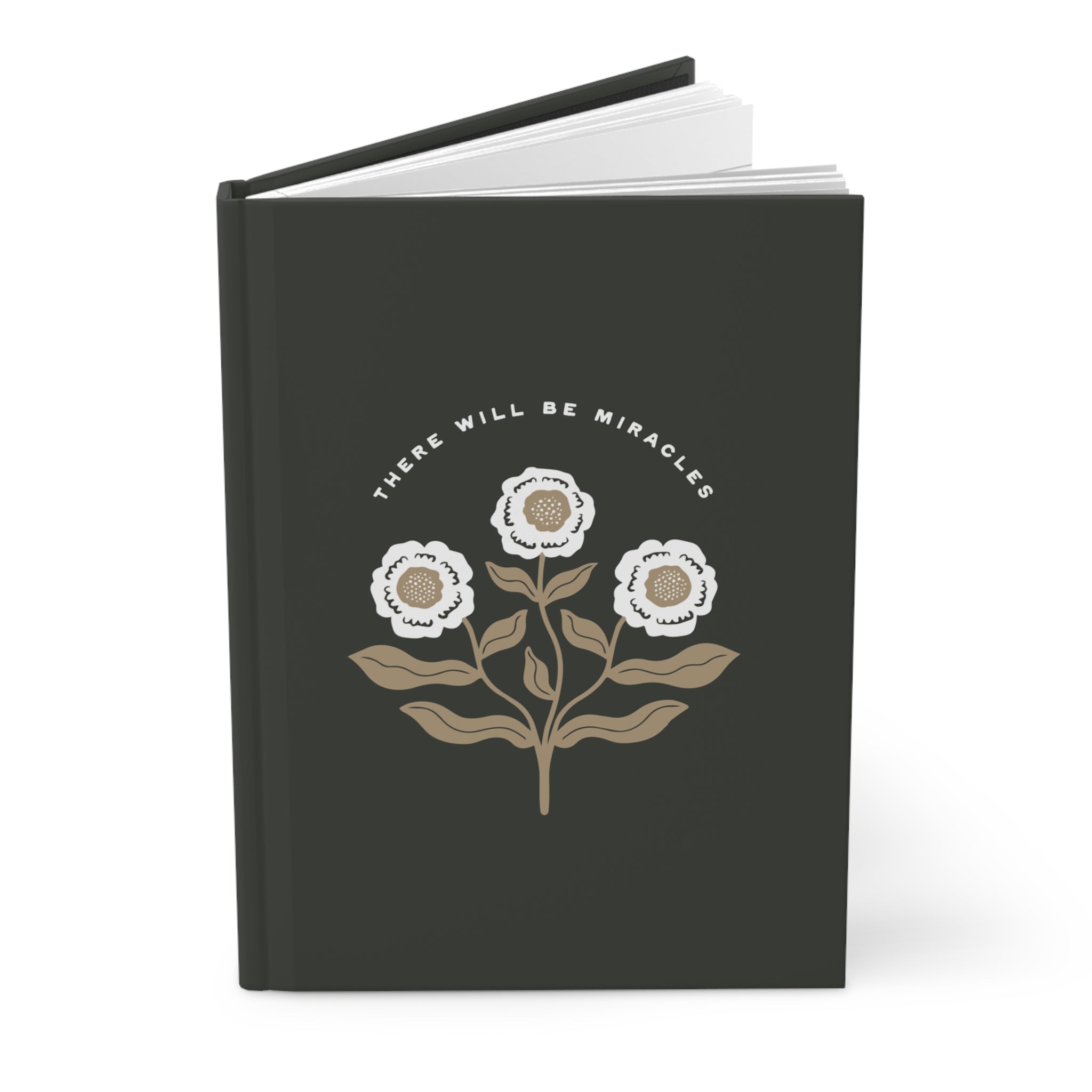 Black notebook with floral design and 'There Will Be Miracles' text on a white background