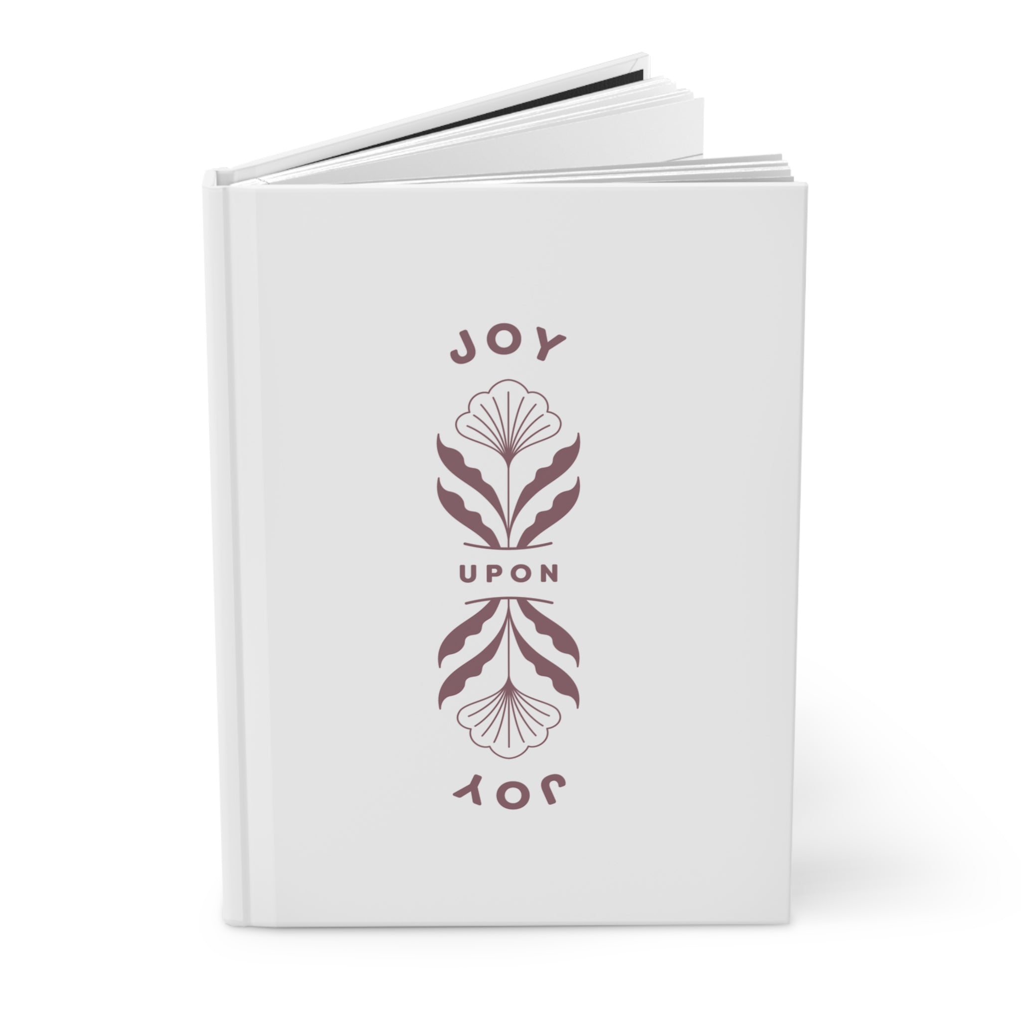 White book with decorative text and floral design on a white background