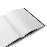 Open notebook with lined pages on a white background