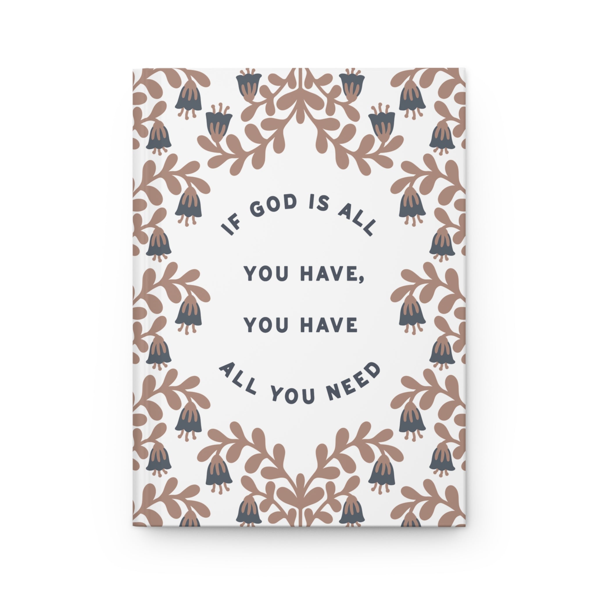 Notebook with floral design and motivational quote on a white background
