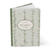 Notebook with floral design and text on a white background