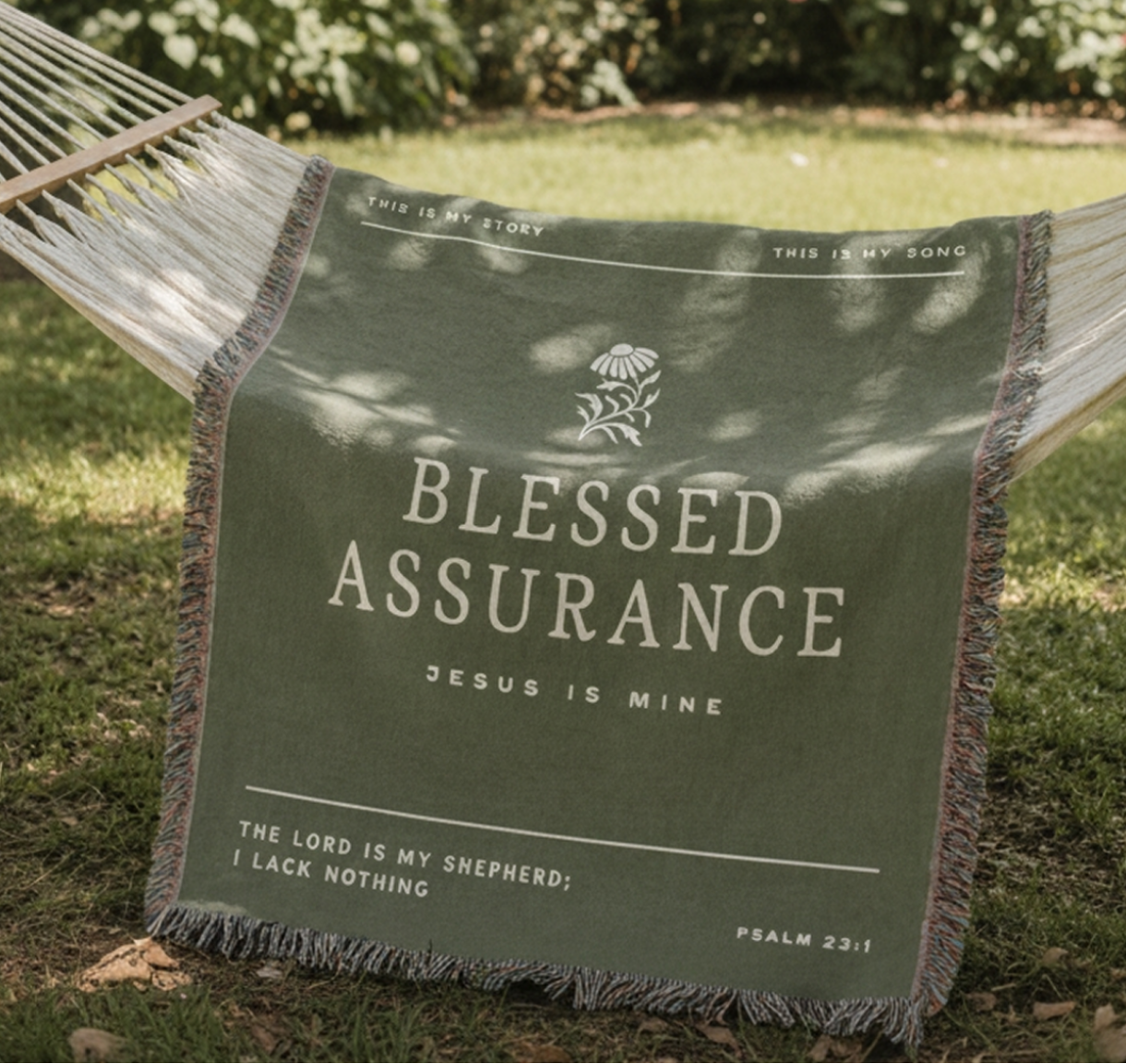 Hammock with 'Blessed Assurance' blanket in a garden setting