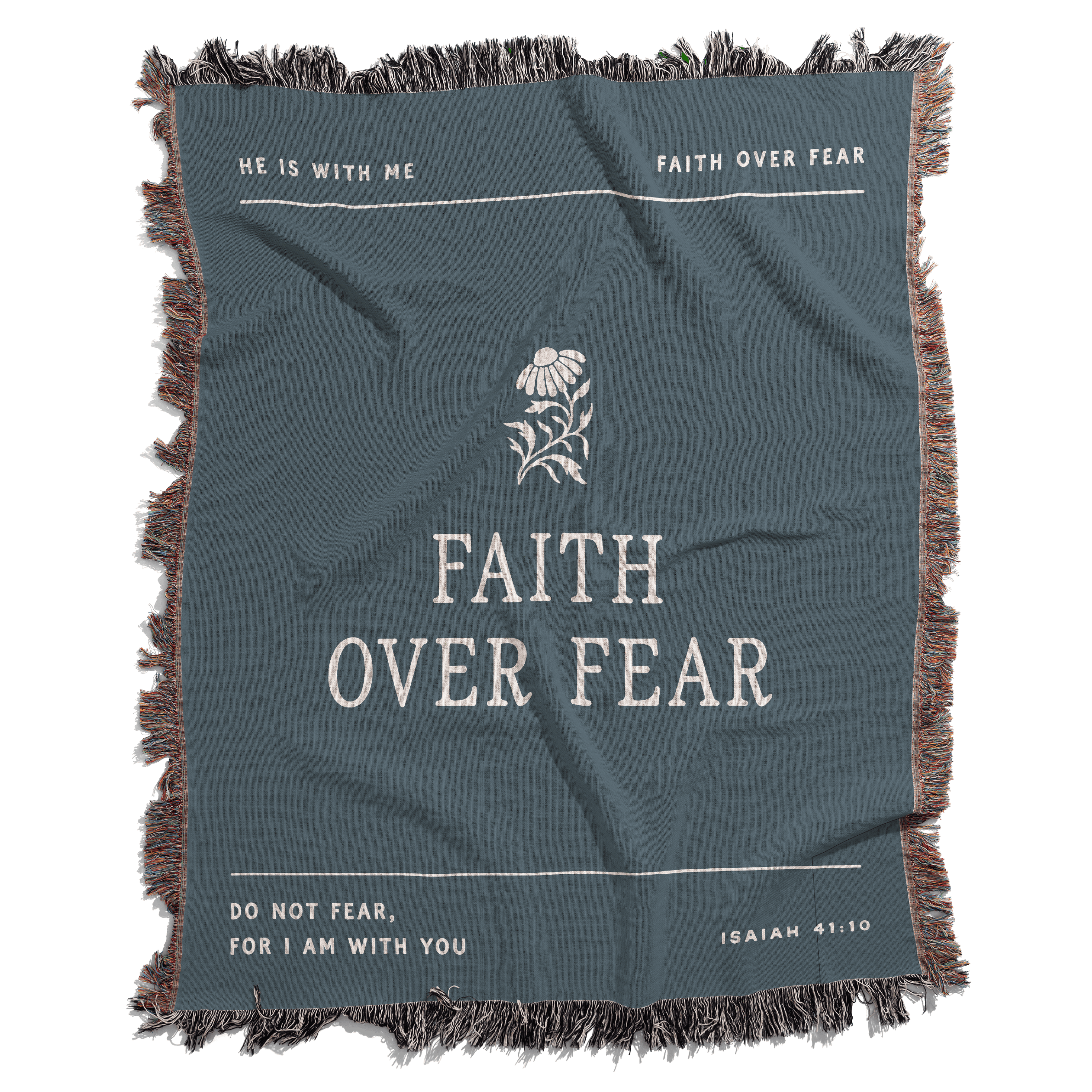 Teal blanket with 'Faith Over Fear' text and floral design on a white background