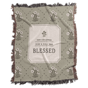 Green blanket with floral patterns and a central text message on a white background
