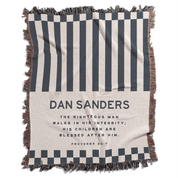 Striped blanket with text and branding on a white background