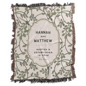 Blanket with 'Hannah and Matthew' text and leaf pattern on a white background