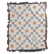 Checkered blanket with star patterns and text on a white background