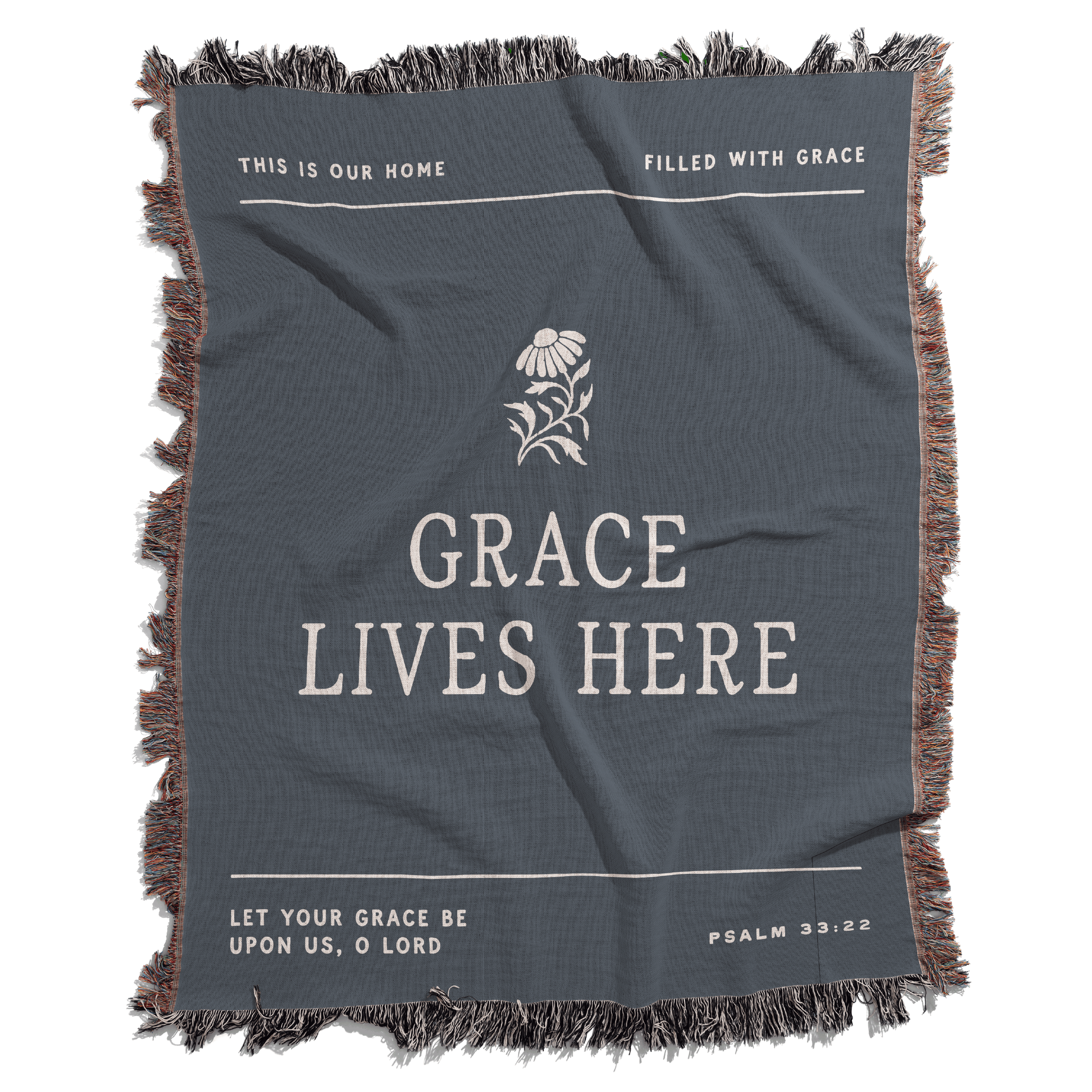 Gray blanket with text and a flower design, featuring motivational phrases.