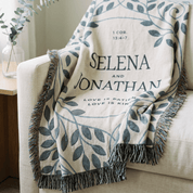 Personalized blanket with names and Bible verse on a couch